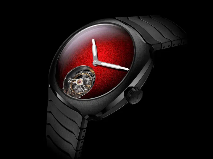 H. Moser & Cie. Streamliner Tourbillon Concept Ceramic in anthracite grey ceramic featuring a logo-free red fumé grand feu enamel dial and a flying tourbillon at 6 o’clock.