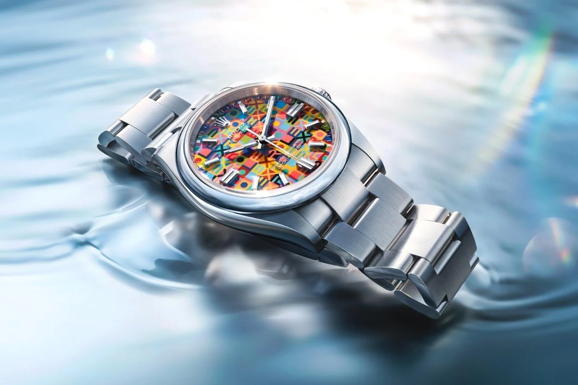 The vibrant Rolex Oyster Perpetual 36 from the Oyster’s 100th anniversary collection, with a multi-coloured Jubilee motif dial and Oystersteel bracelet.