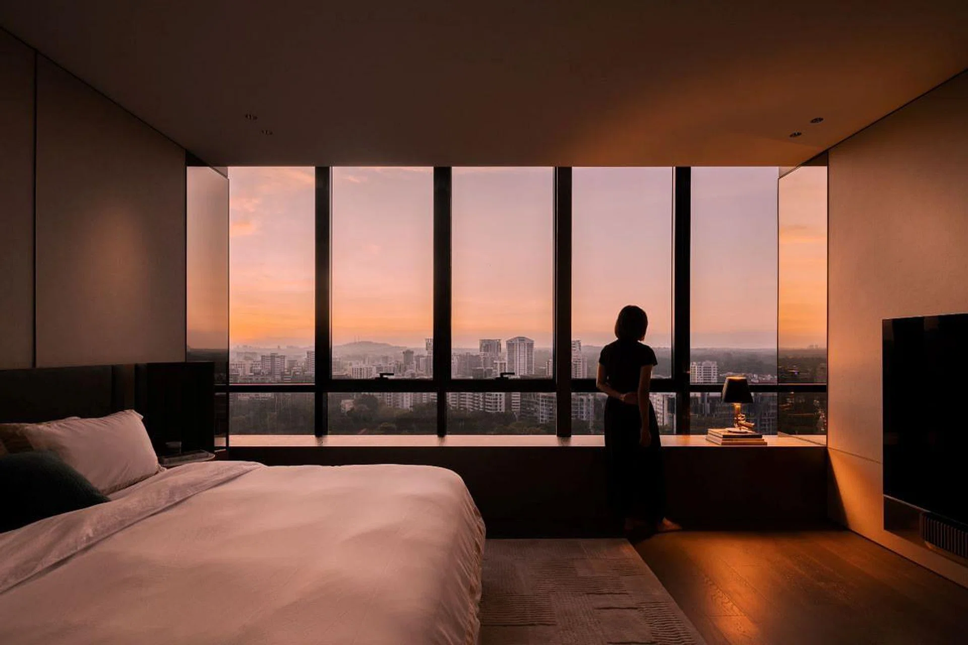 The west-facing window in the master suite drenches the room in warm pastel colours every evening. (Photo: Marcus Lim)