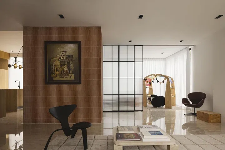 The former study room is now a playroom, with floor-to-ceiling windows that open to the rear garden. (Photo: Studio Periphery)