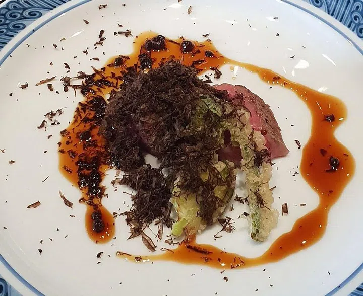 A5 Miyazaki beef with sansho sauce, black truffle, and brussel sprouts
