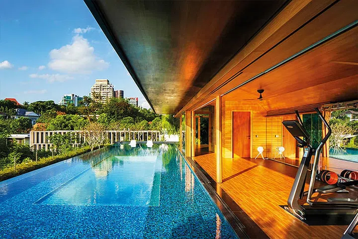 Good-Class Bungalow with sky pool  by Guz Architects camouflages among greenery 