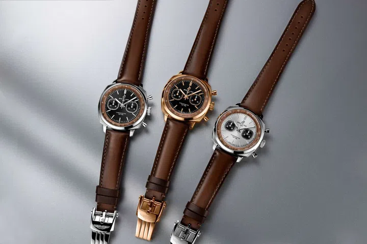 Three Breitling Top Time B01 Chronograph 41 Tribute to Aston Martin DB5 watches in stainless steel, steel with platinum, and 18K red gold.