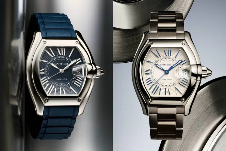 Stainless steel Cartier Roadsters, one with a blue dial and matching rubber strap, and the other with a white dial and integrated stainless steel bracelet.