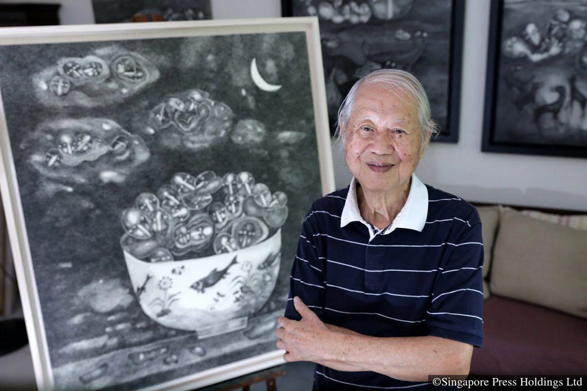 Artist Yu Loon Ching with his painting, Life In A Ricebowl. Photo: The Straits Times / Tiffany Goh