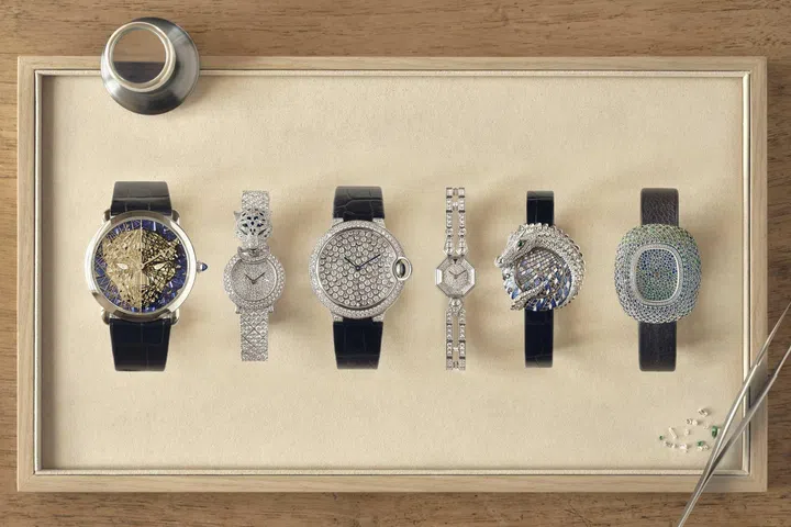 A row of Cartier jewellery watches crafted at the Maison des Métiers d’Art in La Chaux-de-Fonds, showcasing intricate gem-setting, engraving, and decorative craftsmanship.