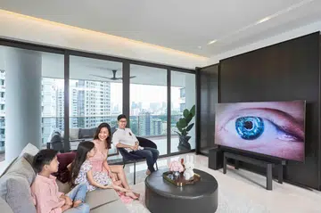 Dr Claudine Pang and her family with the Samsung Neo QLED 8K TV