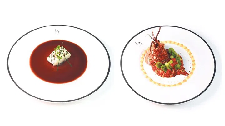 Left: Line caught sea bass, muscat grapes, verjus sauce. Right: Blue lobster from Normandy, cocktail sauce