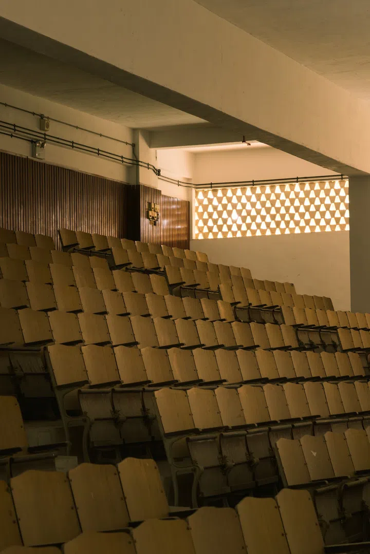 The school hall of the former Nan Chiau High School, with its rows of wooden chairs, was left intact. (Photo: New Bahru)