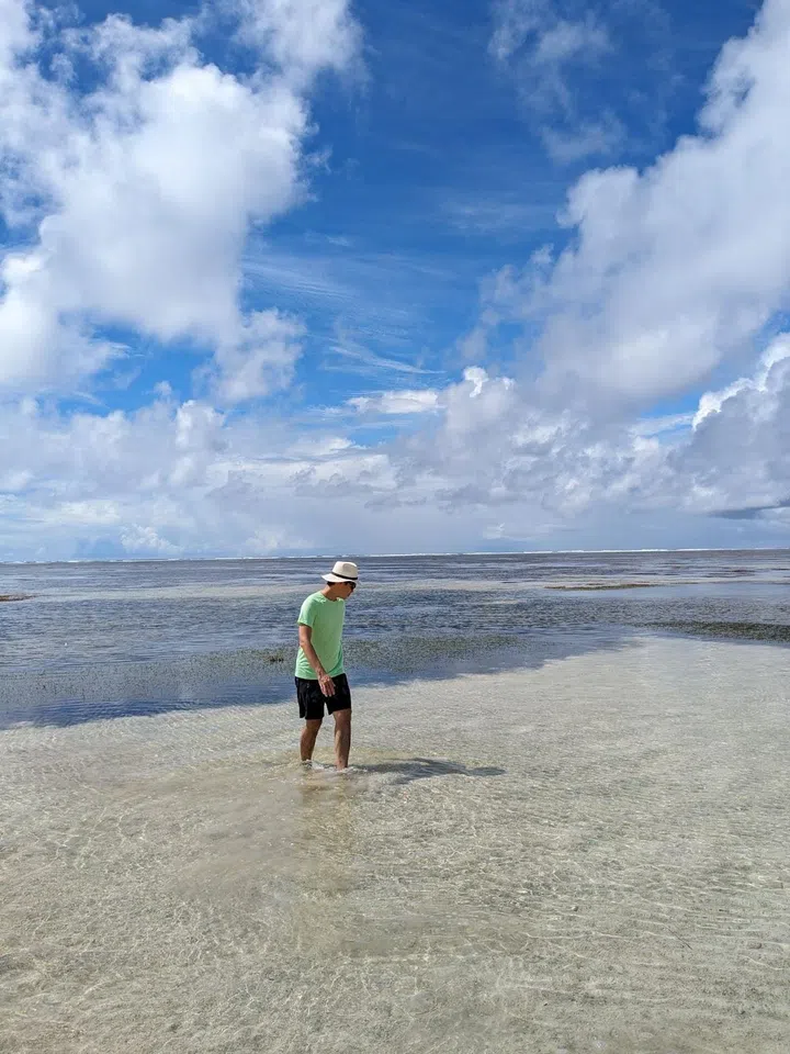 The writer takes a reef walk around Platte Island. (Photo: Kenneth SZ Goh) 