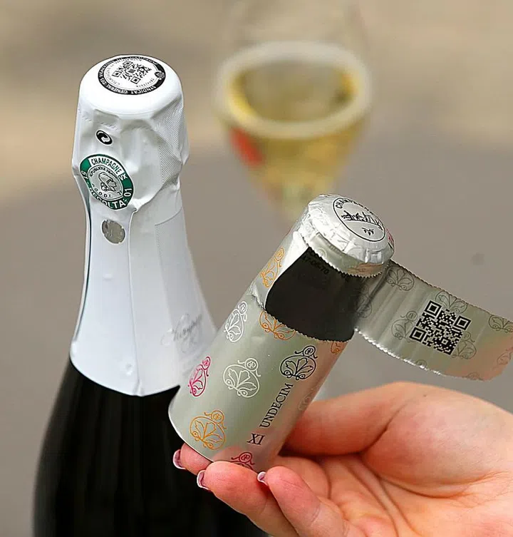Using a combination of unique QR codes and radio-frequency identification (RFID) emitters integrated into the label or the bottleneck foil, each bottle of bubbly can now be tracked to help battle counterfeiting of the luxury product. (Photo by FRANCOIS NASCIMBENI / AFP)