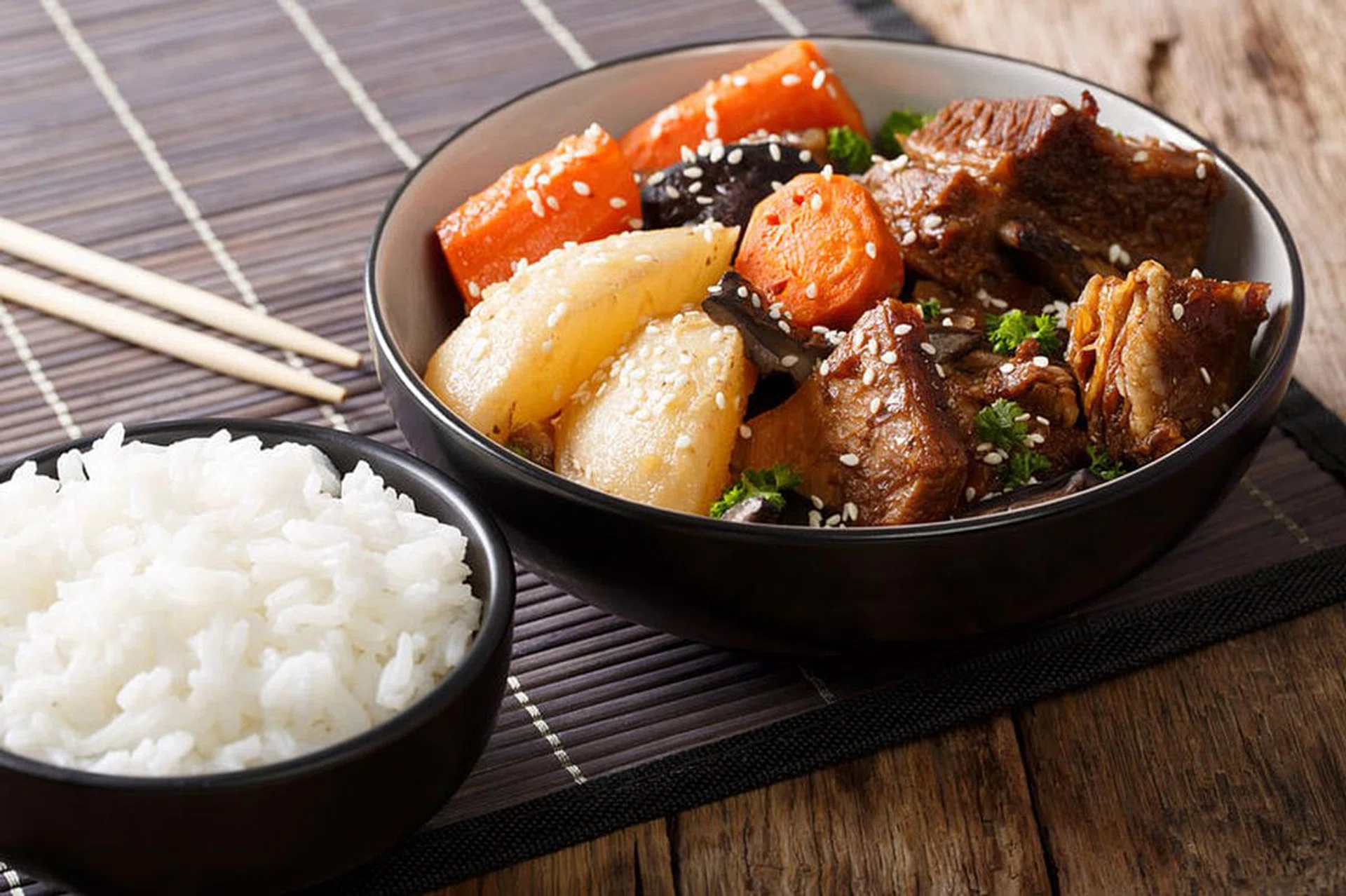 Galbi jjim or Kalbi Jim - Korean Braised Beef Short Ribs with rice closeup. horizontal