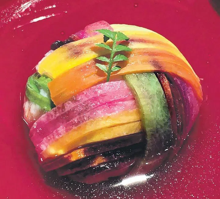 Narisawa’s prawn dumpling decorated with rainbow vegetable strips. 