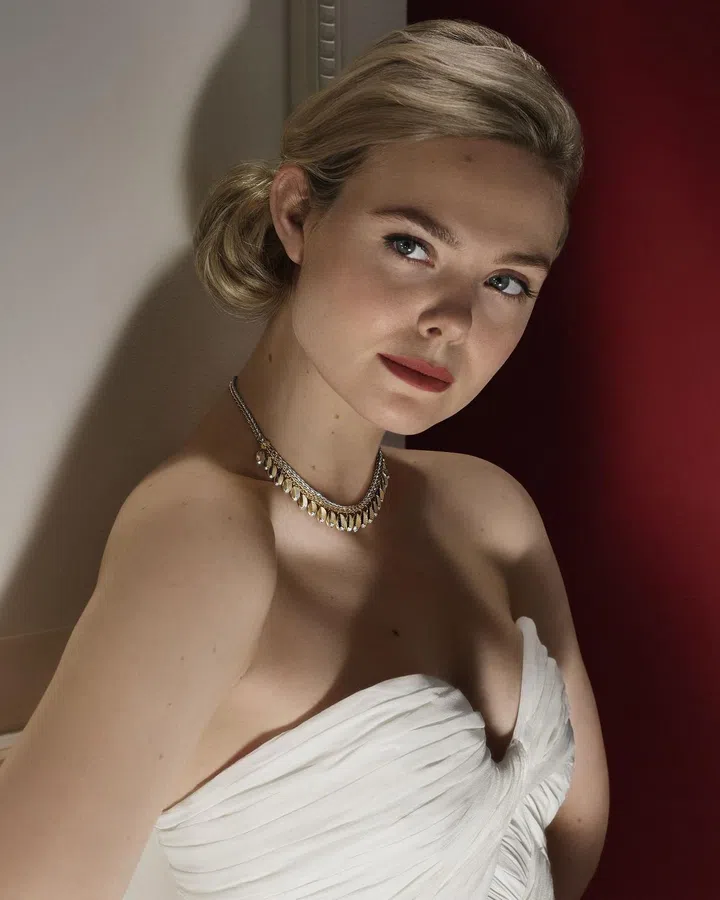 Actress Elle Fanning wears a Grain de Cafe necklace. (Photo: Cartier)