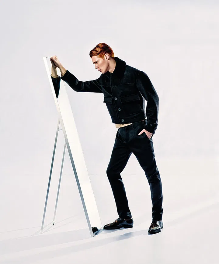 Embrace the dark side in classic black. Black wool jacket, grey wool sweater, black wool pants and black leather shoes from Burberry Prorsum.