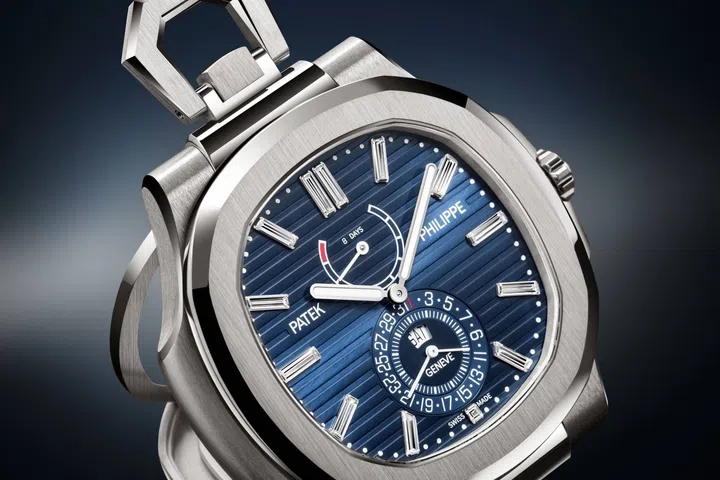 Patek Philippe Nautilus 50th anniversary Ref. 958G-001 desk watch in white gold, featuring a blue sunburst dial with horizontal relief embossing, baguette-cut diamond hour markers and white gold baton-style hands.