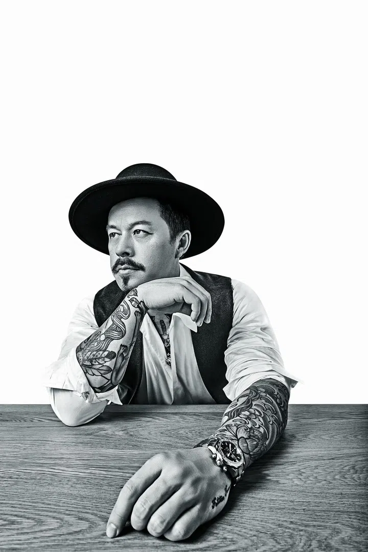 Mike Wiluan CEO of Infinite Studios with tattoos exposed