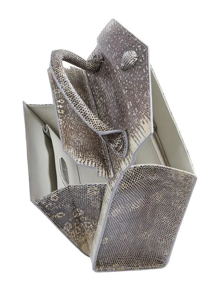 The unique trapdoor opening, a design signature of EthanK, can be found in styles like this iconic Alla Bag, as well as the Duchess Bag (Photo: EthanK)
