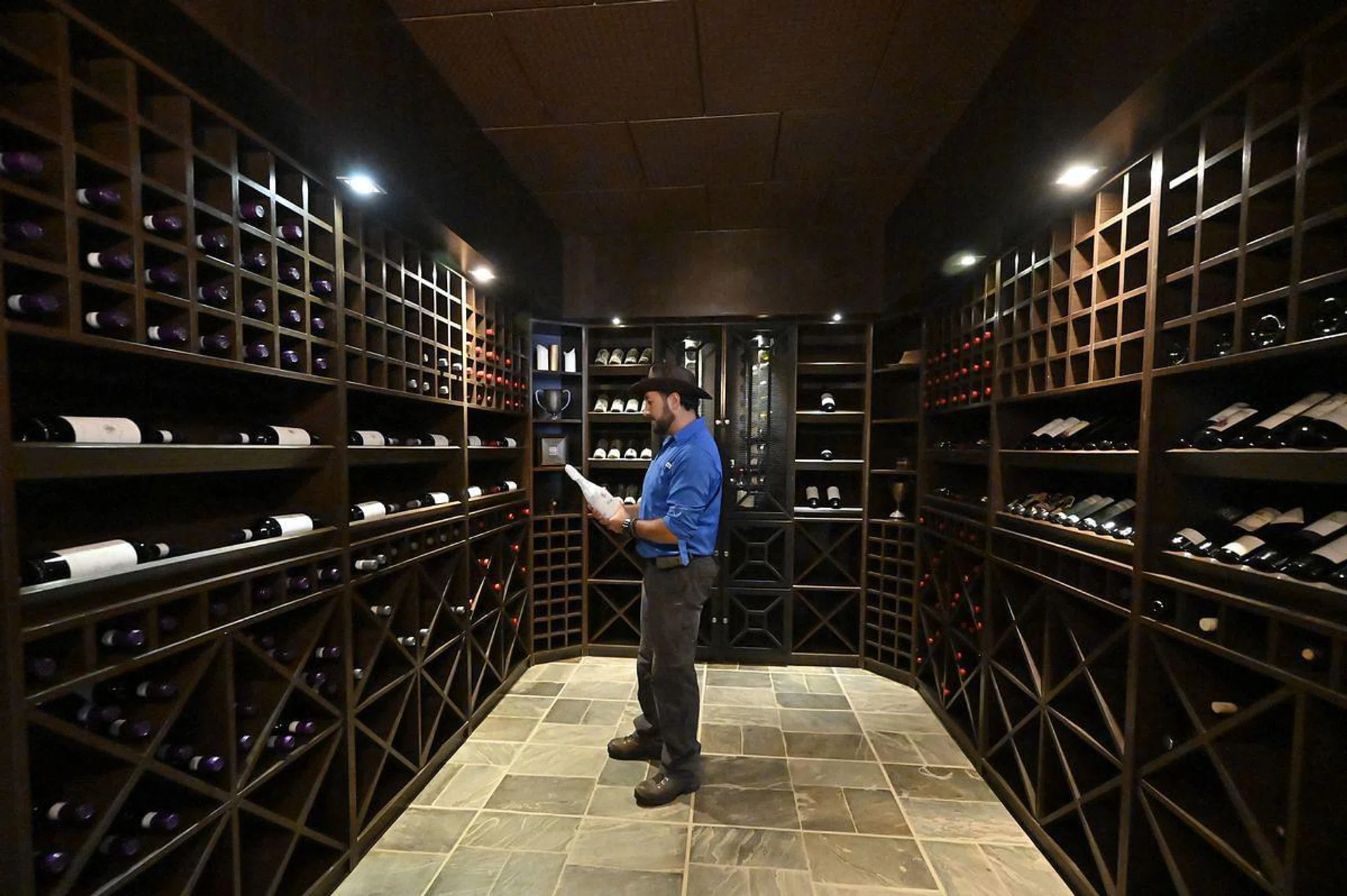 Kolhlberg's Winery Manager Helmut Kohlberg is seen in a wine cellar at the Kolhlberg Winery, in Valle de la Concepcion community, some 30 km from Tarija, Bolivia on March 27, 2021. - Between 1,600 and 2,000 meters above the sea level and with a temperate climate in the south of the country, Bolivian companies collect a tradition of hundreds of years of the Jesuitic Missions to produce High Altitude Wines, which now dream of reaching international markets. (Photo by AIZAR RALDES / AFP)
