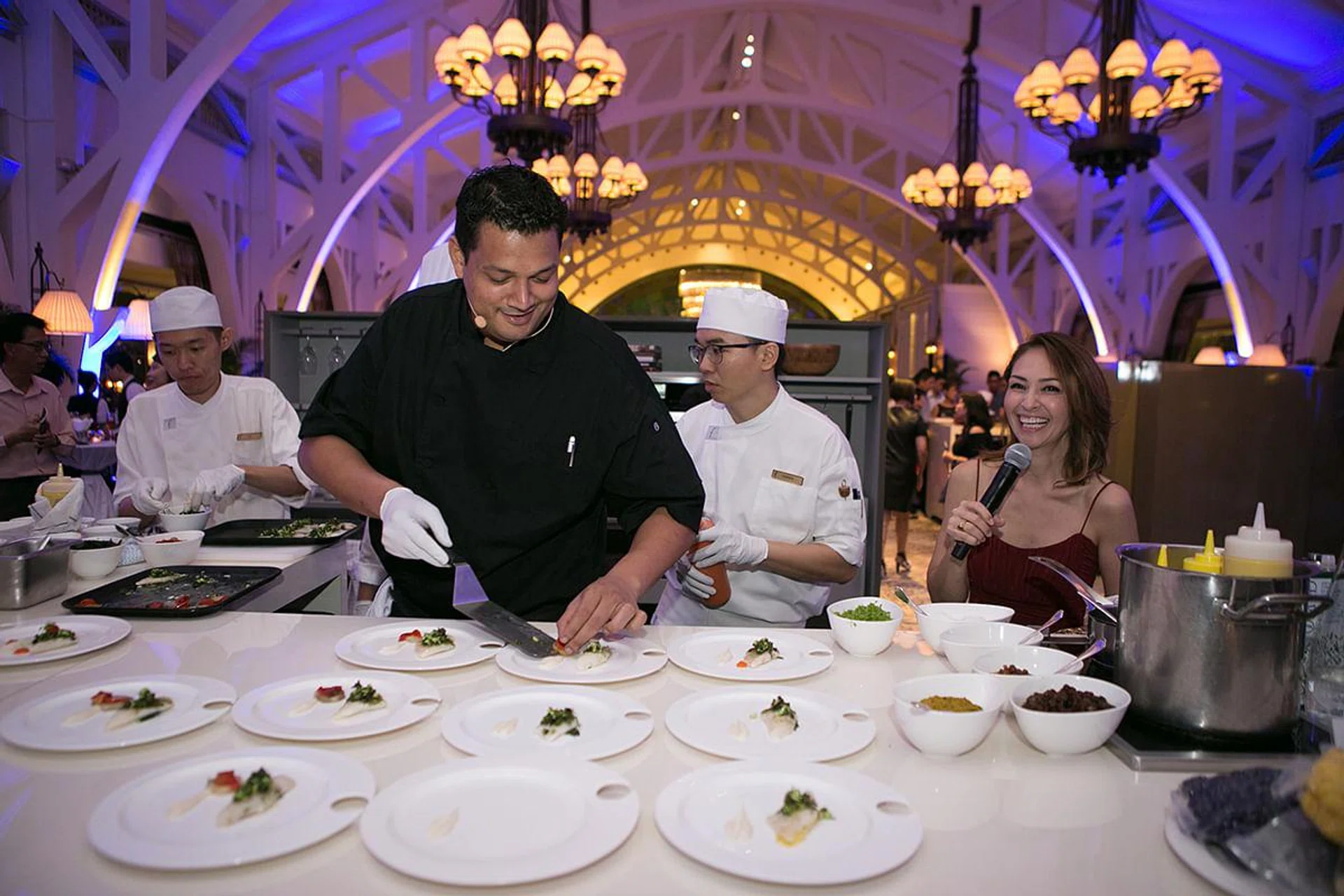 Top chefs Malcolm Lee and Timothy de Souza preparing their creations  for guests