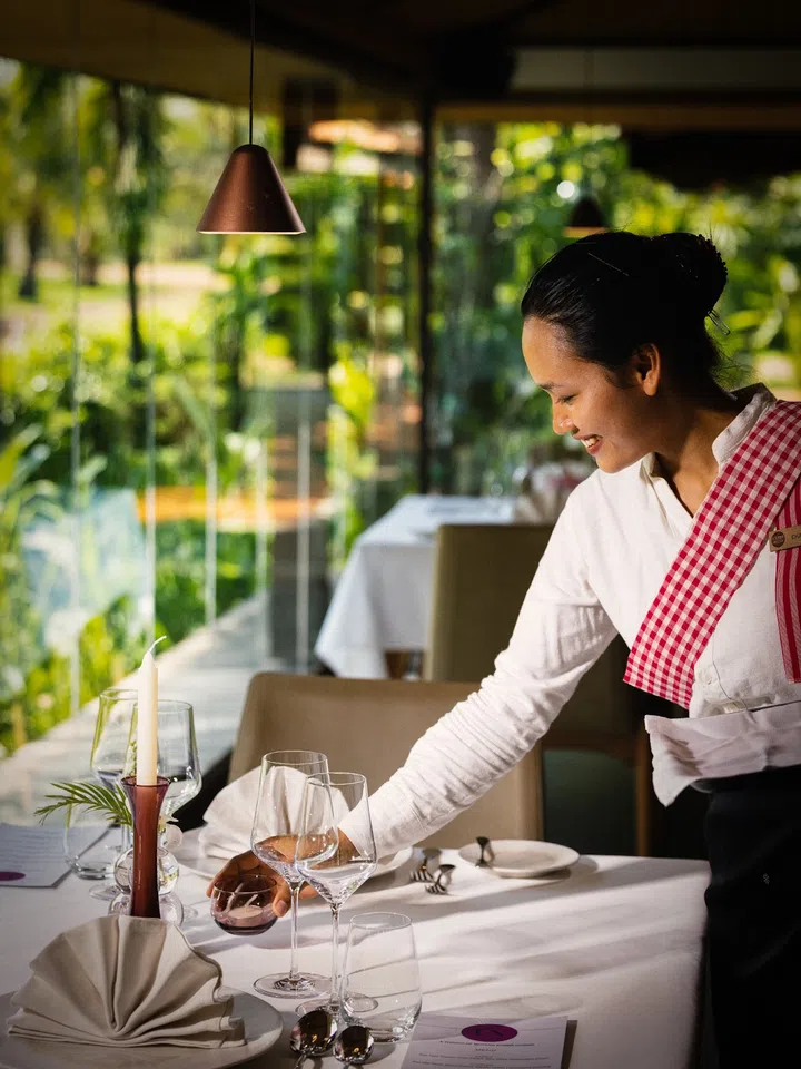 Setting the table at fine-dining Restaurant Un, named after its Khmer chef Mariya Un Nou. (Photo: Smiling Gecko Cambodia)