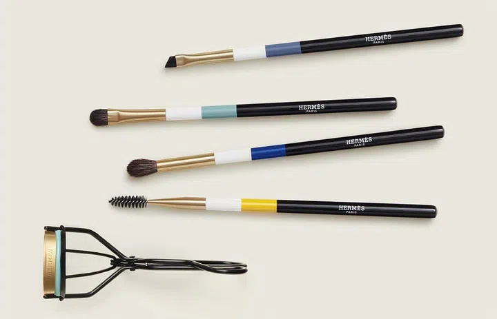 Eyeshadow and brow brushes, and an eyelash curler from the Hermes Le Regard range. (Photo: Hermes)