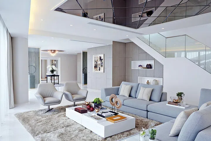 The living area feels more spacious because of the absence of walls separating it from the foyer and dining area.