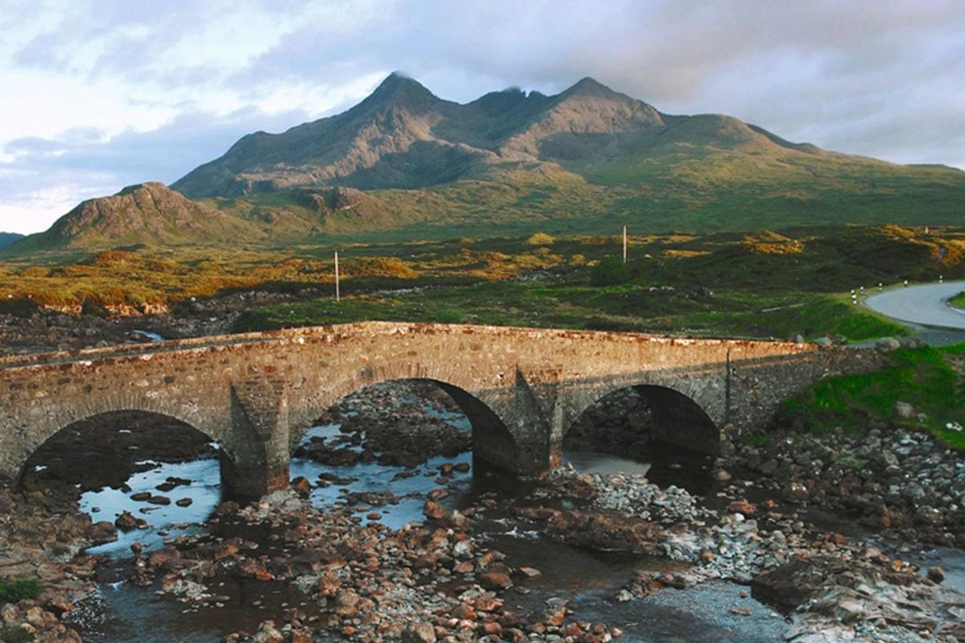 The dramatic peaks
of the Cuillin mountains are best admired from Sligachan, a tiny town on the Isle of Skye. The craggy peaks and windswept glens belie the region’s wealth of game produce and distilleries.
