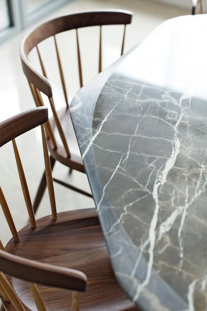 Details matter, as evidencedin the double curved edge of a stone table.