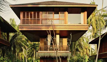 On Bali’s west coast, Lost Lindenberg offers breezy, treehouse-style rooms perched on elegant wooden towers — inviting guests to connect with the natural surroundings.