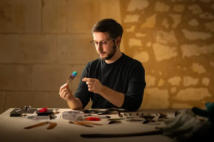 Feather artist Julien Vermeulen, who created the intricate featherwork serpent for Vacheron Constantin’s Feathersnake watch.