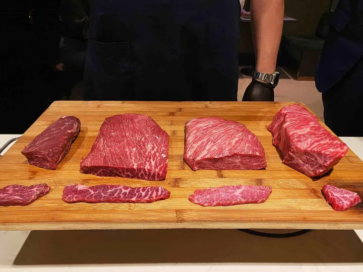 Loy shows off cuts of onglet, flat iron, rib cap and zabuton. Photo: The Peak