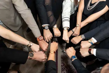 A group of watch collectors supporting Siam Paragon Bangkok Watch Week 2026 holding up their wrists to show their watches.