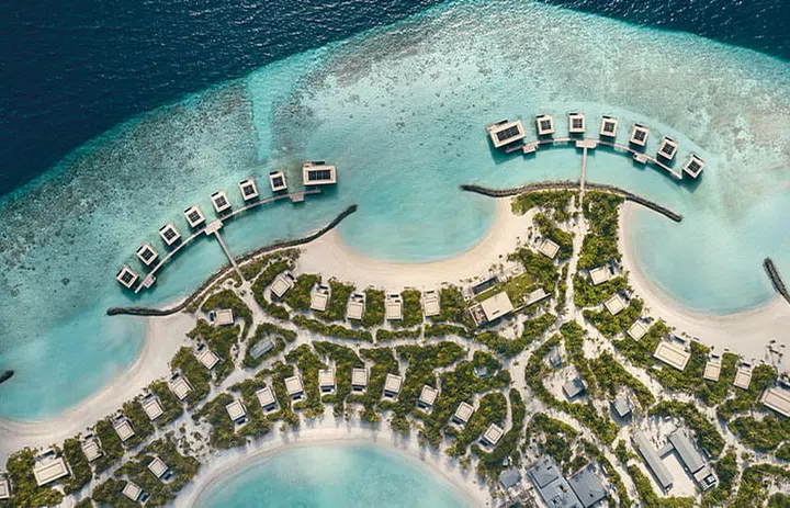 Verdant landscaping envelops each of Patina Maldives’ 90 contemporary one- to three-bedroom Beach and Water Pool Villas.