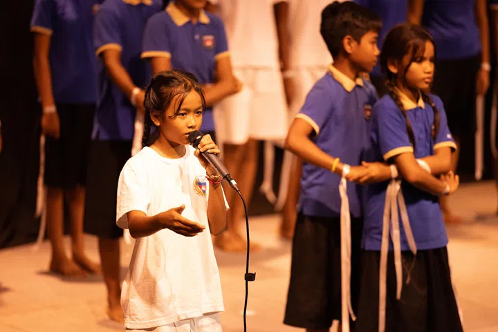 Students from the Smiling Gecko performing songs at the opening ceremony. (Photo: Smiling Gecko Cambodia)