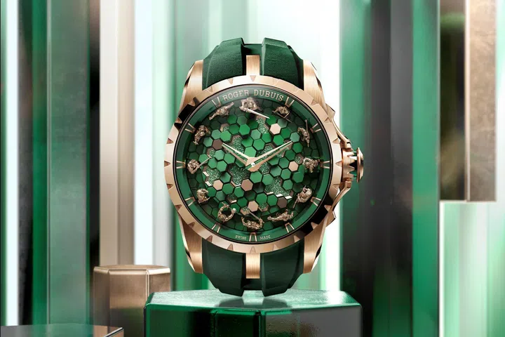 Roger Dubuis Excalibur The Metamorph Merlin watch in pink gold, featuring 12 miniature knights encircling a sculptural green dial composed of 57 blocks of varying heights and materials.