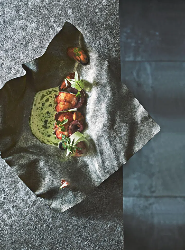 A seafood soup with langoustine, octopus and mussels is jazzed up with ikura and herbs like Thai basil to highlight the freshness of the produce.  