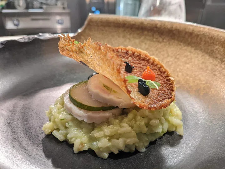 Chef Joe Leong's take on spring onion pesto risotto with chicken roulade and pickled cucumber crowned with a ginger tuile (Photo: Kenneth SZ Goh) 
