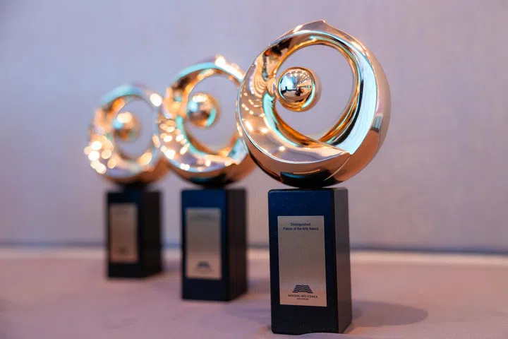 Three awards positioned at a 3/4 angle