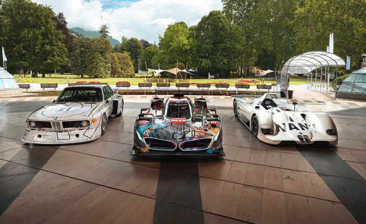 Julie Mehretu’s BMW 20th Art Car showcased at Concorso d'Eleganza Villa d'Este alongside the Frank Stella (left) and Jenny Holzer (right) editions from 1976 and 1999, respectively. (Photo: BMW AG)