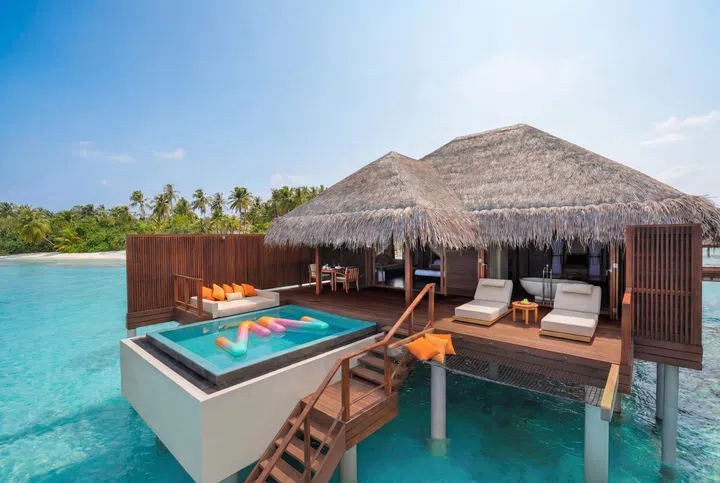 Panoramic view of an overwater Ocean Villa at Ayada Maldives surrounded by clear blue lagoon and the Indian Ocean.