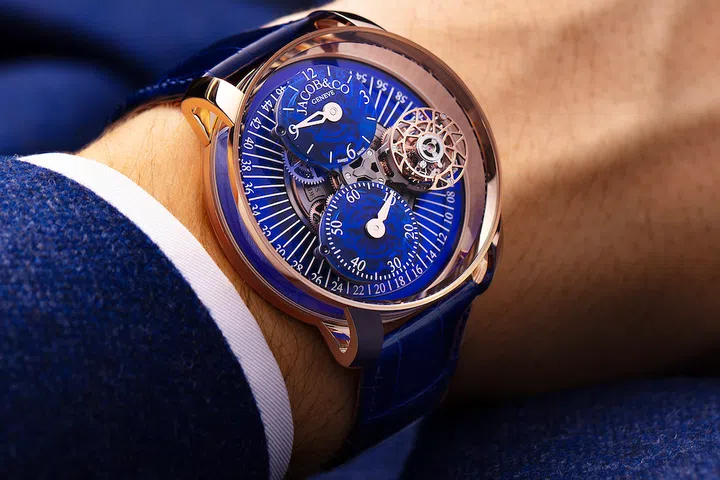 In the 99-piece Astronomia Regulator, hour and minute sub-dials sit on a platform that rotates once every 60 seconds beneath domed sapphire. 