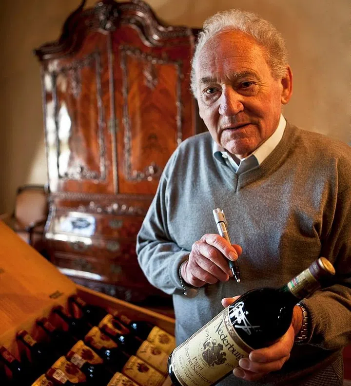 Gunter Brozel signing bottles for a charity auction