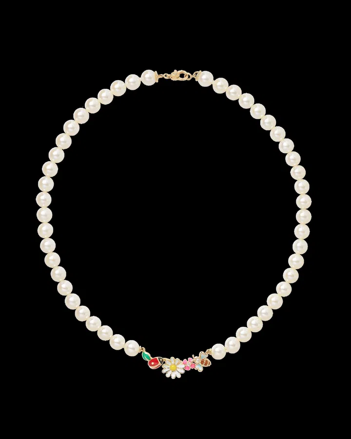Dior Diorette necklace featuring colourful lacquered charms of daisies, bees and lucky motifs, set along freshwater pearls with diamond accents.