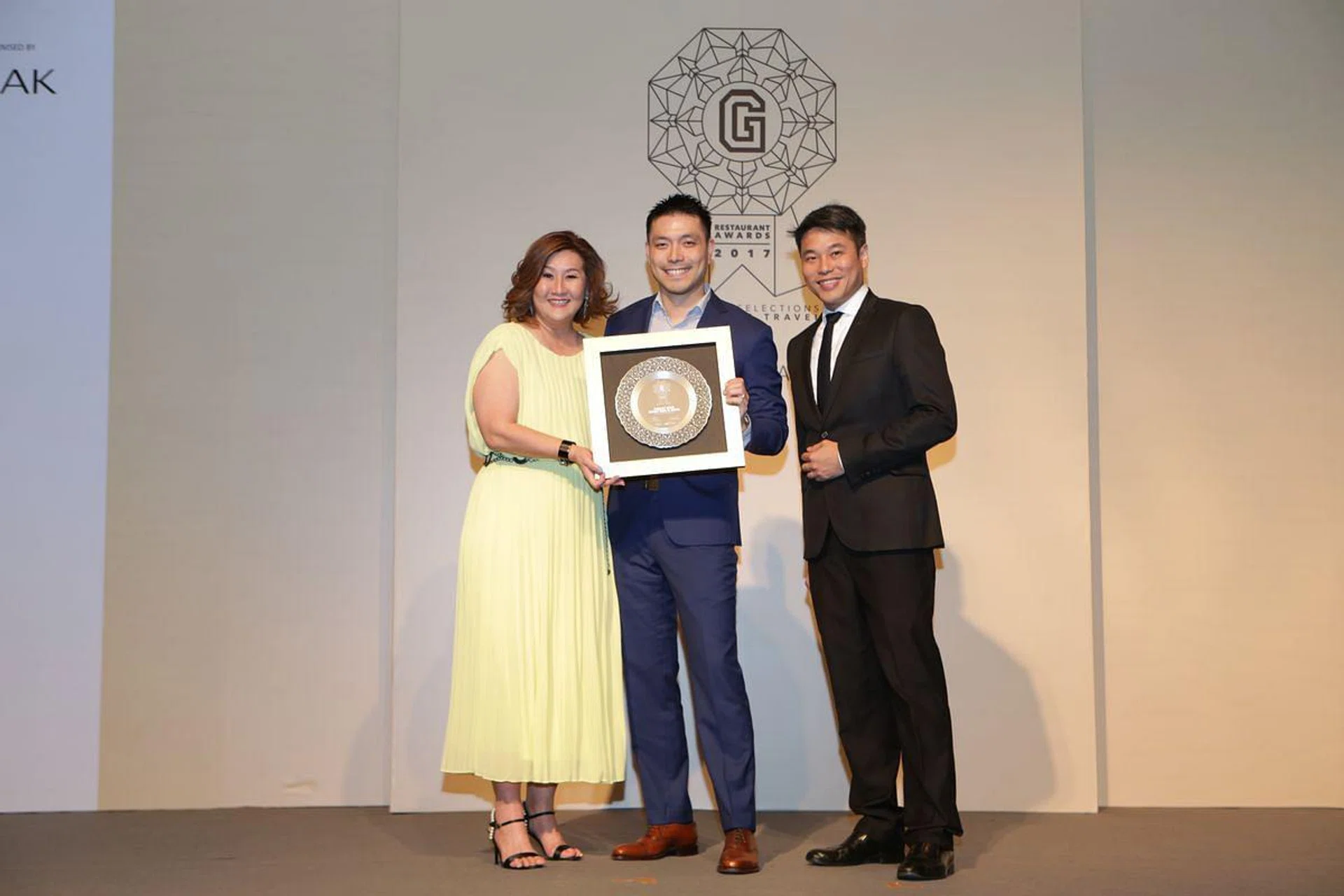 L to R: Group editor Joanna Lee-Miller, Tay Yi Ming receiving Best New Restaurant (Asian), and Desmond Tan, OCBC Bank, Head, Group Lifestyle Financing Global Consumer Financial Services 