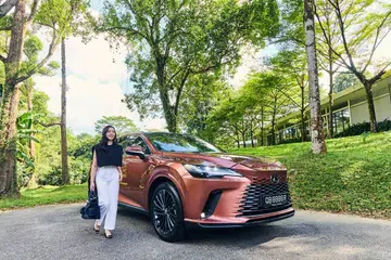 Kara Arissa Tan with the Lexus all-new RX 350h, which pairs a 2.5-litre inline-four engine with a powerful, self-charging electric motor to deliver 247 horsepower with high fuel efficiency of up to 17.8km/L.