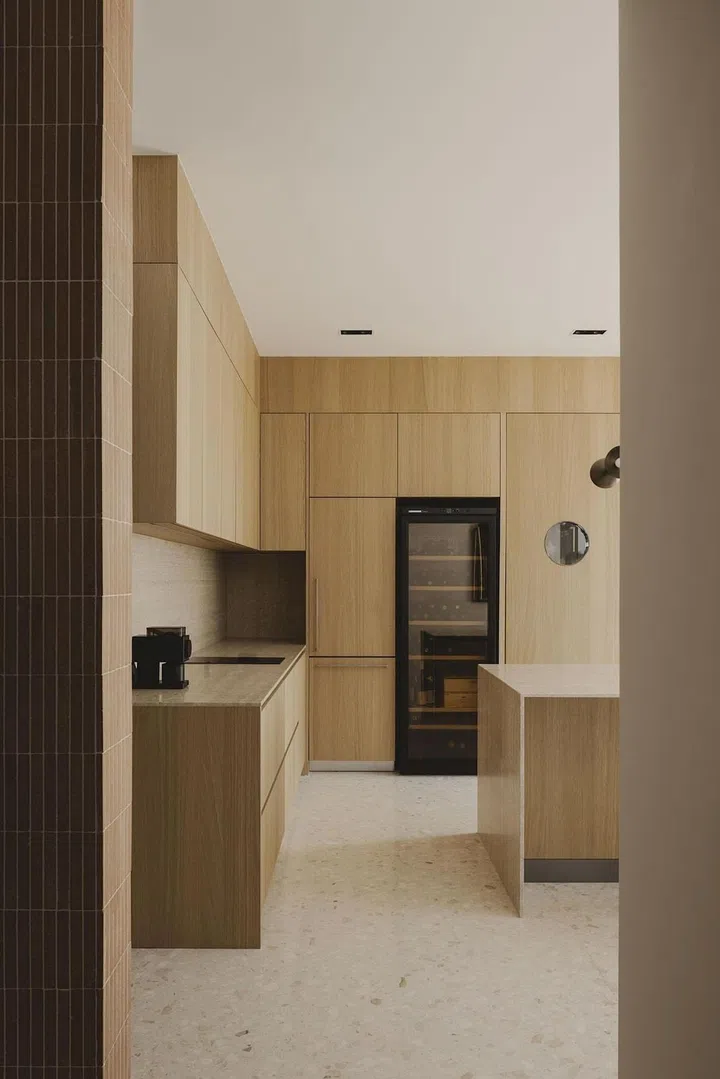 The new dry kitchen in the newly configured plan has a striking lamp from Apparatus Studio. (Photo: Studio Periphery)