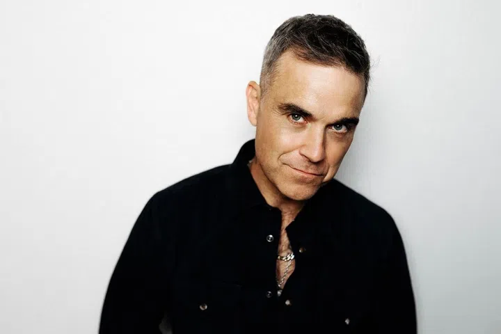 A pin-up of British pop culture, singer Robbie Williams has long collected art, and is known to pick up a paint brush himself (Photo credit: Sotheby's)