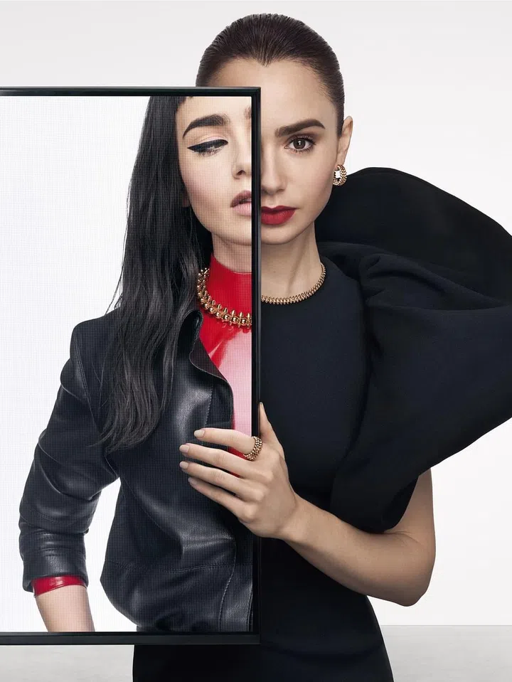 Lily Collins wearing Clash de Cartier pieces.