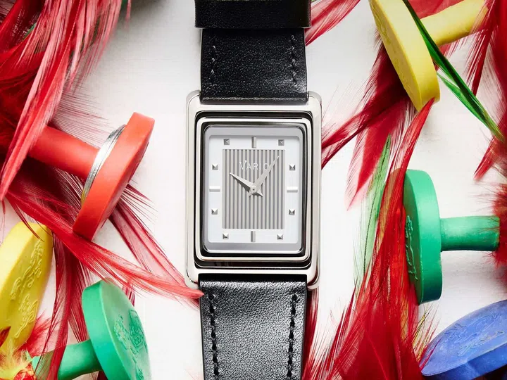 Singapore watch brands: The Vario Versa Reversible Single Time White Tuxedo Automatic with a rectangular stainless steel case, vertically striped white dial inspired by Art Deco design, and a reversible case that pivots to reveal the exhibition caseback.